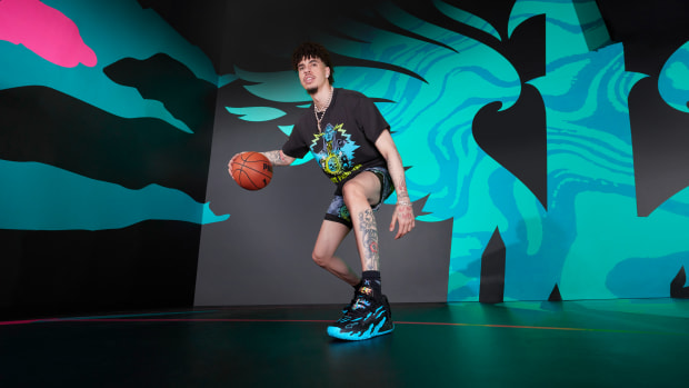LaMelo Ball models black and blue PUMA apparel.